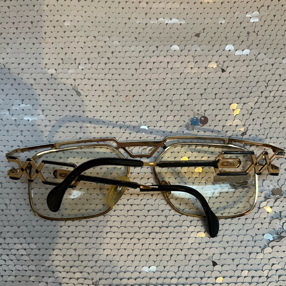 Vintage gold/black Cazal glasses. Needs cleaning, right arm broke. Priced to go